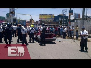Gresca entre taxistas deja un policía lesionado y autos volcados / Vianey Esquinca