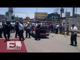 Gresca entre taxistas deja un policía lesionado y autos volcados / Vianey Esquinca