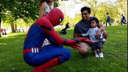 kid is terrified of lad dressed up in spiderman costume