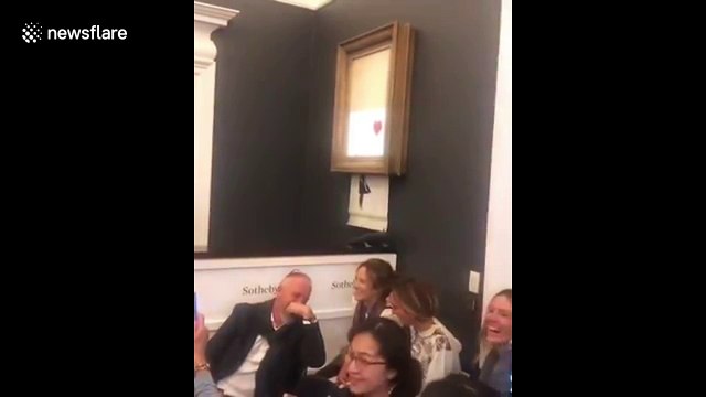 Banksy artwork self-destructs live at Sotheby's after selling for 1 million pounds