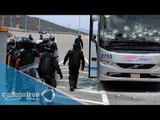 Enfrentamiento de normalistas con policías deja 3 lesionados