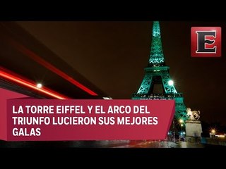 Monumentos emblemáticos de París se iluminan de verde contra el cambio climático