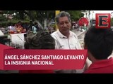 Identifican al hombre que izó la bandera de México entre los escombros de Juchitán