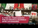 Guerra de pancartas, gritos y empujones en el Senado