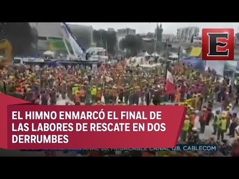 Imagen de la solidaridad: Brigadas de rescatistas entonan el Himno Nacional