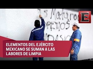 Retiran vallas y borran pintas tras marcha del 2 de octubre