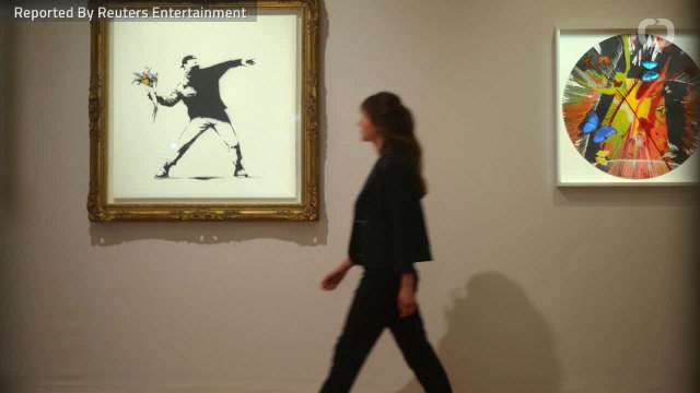 Banksy's Balloon Girl Painting Self-Destructs After Being Sold For Over 1 Million Pounds