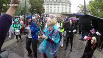 Zombies walk through the streets of London for charity