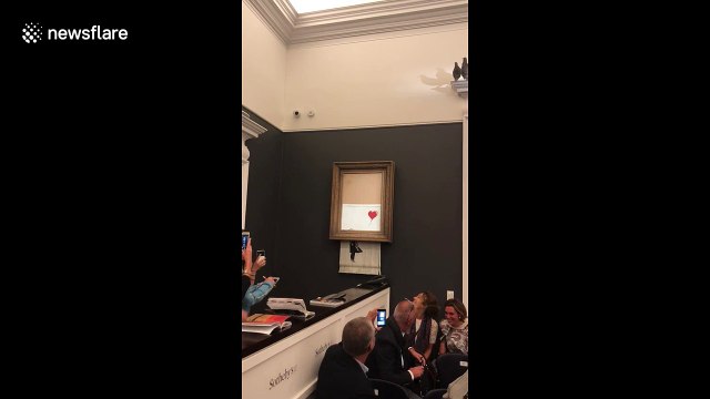Banksy artwork self-destructs moments after selling for 1 million pounds