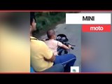 Toddler filmed riding a motorbike on a public road | SWNS TV
