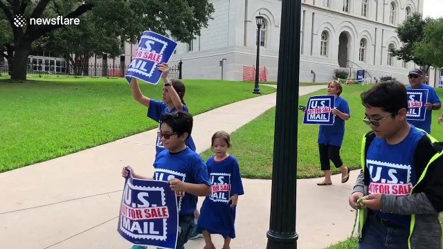 Protesters chant US mail, not for sale in rally against Trump's proposed privatization of postal services