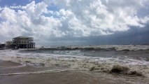 Double red flags raised as monstrous waves attack Dauphin Island beach ahead of Hurricane Michael landfall