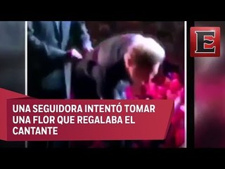 Luis Miguel obsequia beso a fan que cayó en su concierto