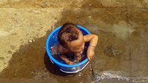 One Year Baby Taking Bath Himself.