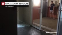 Michael's winds blows out condo doors and shatters glass