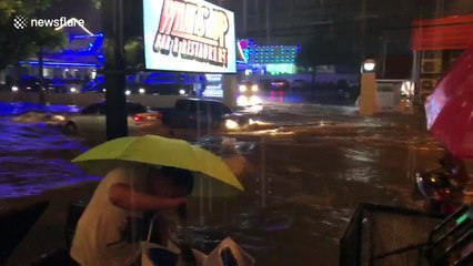 Diners stranded after monsoon turns road into flooded river