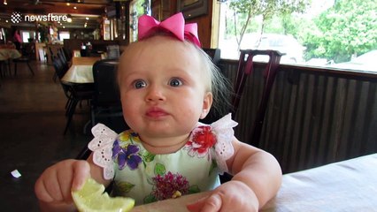 Baby eats a lemon for the first time