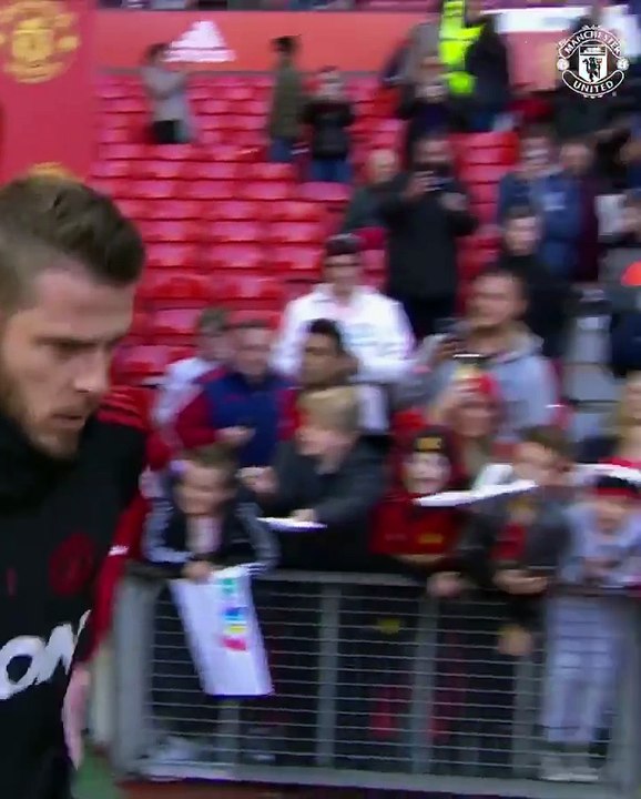 David De Gea leads the Reds out for the warm-up...