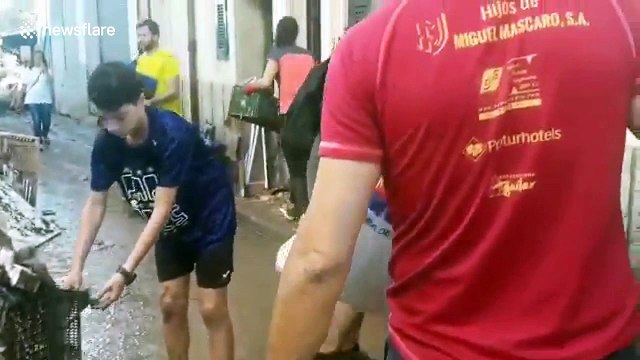 Majorca residents continue to clean up after deadly flash flooding