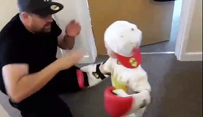 dad teaches son how to box