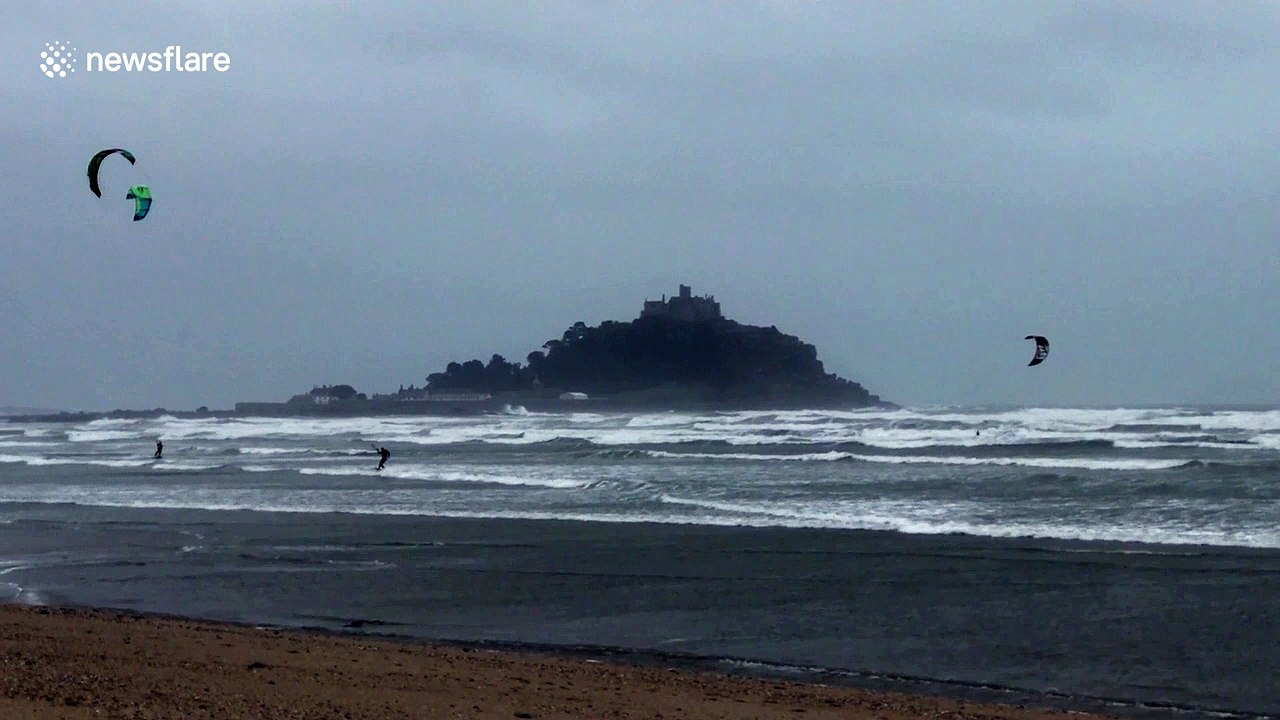 Ocean high! Kite surfers make most of gale-force winds in front of iconic St Michael's Mount