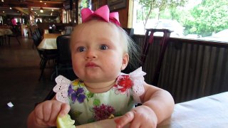 Adorable moment baby eats lemon for the first time