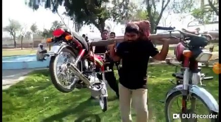 mirza shoaib baig from okara lifted bike on his shoulders