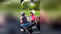 Pillion passenger wears helmet the wrong way round