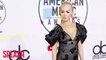 Rita Ora to auction off stage outfits
