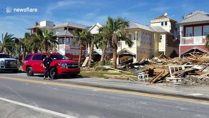 Piles of debris from flattened houses lie on side of Mexico Beach roads