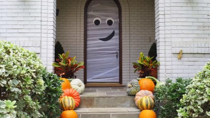 Spook Trick-Or-Treaters with this Front Door Mummy Decor