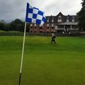 Kid chips the ball into the hole