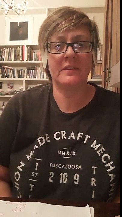 Woman flicks CD's over her eyes