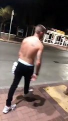 slips down off the pavement and falls over