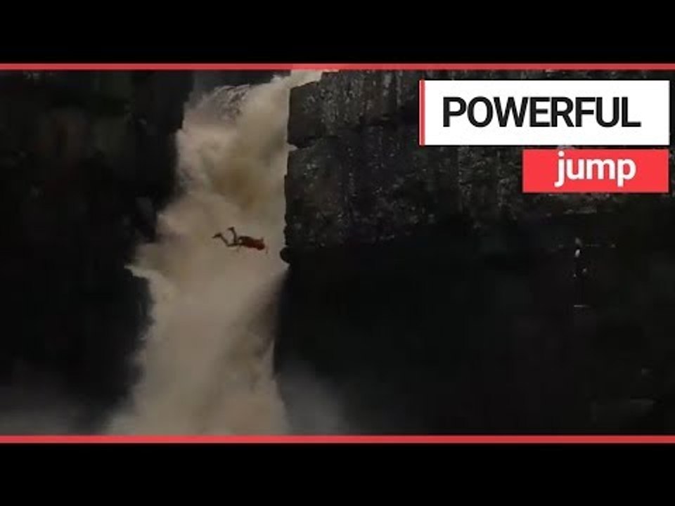 Cliff jumper "nearly dies" after backflipping into powerful waterfall | SWNS TV
