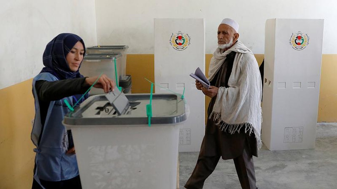 Afghans defy Taliban threats and vote in parliamentary elections