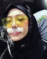 Girl enjoying Shisha smoking in full fun environment