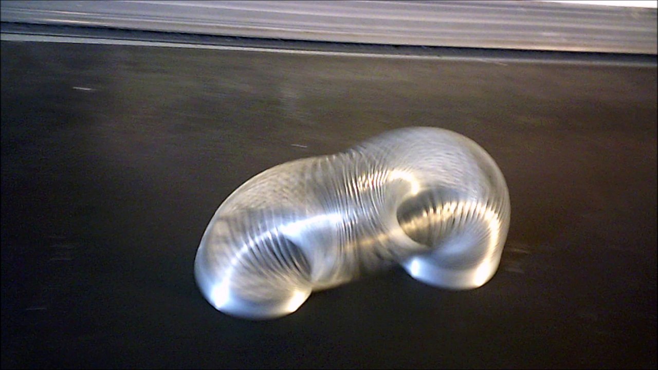 SLOW MOTION 50 WALKING SLINKY ON TREADMILL.