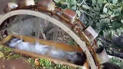 Collecting water from a well - old school style!