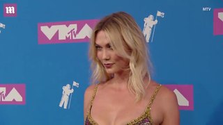 Glittering gold! Karlie Kloss wears tight silver and gold dress