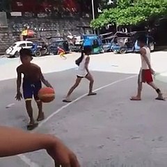 little girl beats a boy in ball handling