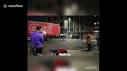 Eccentric man with megaphone shouts at jay-walkers in London