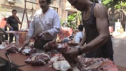 The blood of lambs runs through Cairo's streets despite fines, high prices