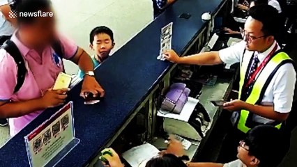 Chinese man slaps airport worker in face with iPhone after flight cancelled