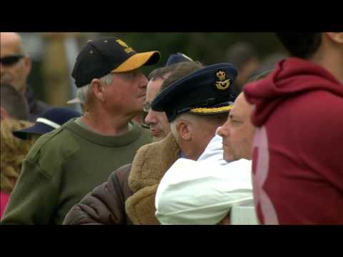 Spitfires fly past at Goodwood Revival in a moving Battle of Britain commemoration