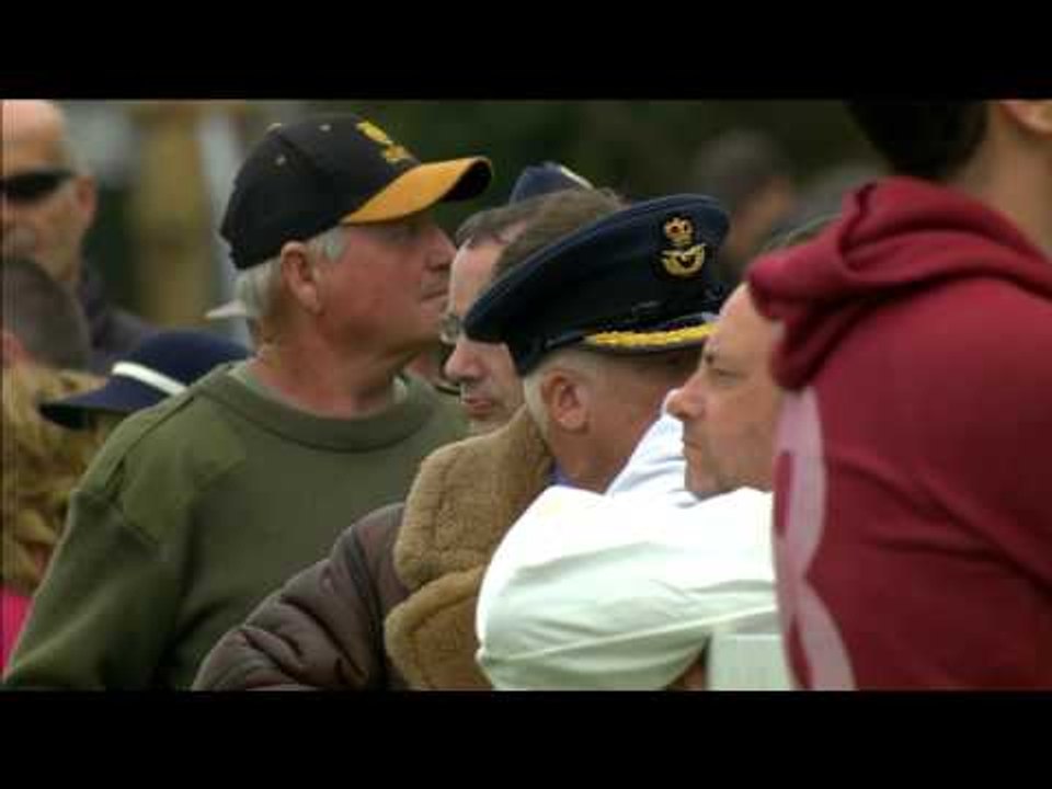 Spitfires fly past at Goodwood Revival in a moving Battle of Britain commemoration
