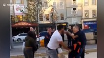 Passerby breaks up fight between two men in broad daylight