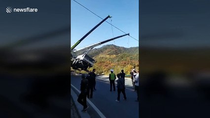 Thrilling scene as crane driver jumps off falling machine during rescue attempt