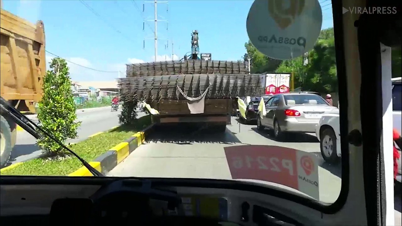 Truck Driver With Wide Load Squeezes Through Traffic