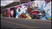 Graffiti artists brighten up industrial zone in Bogota with colourful murals